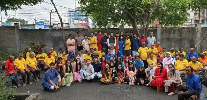 Volunteers and residents of the old age home in a big group photo in 2019