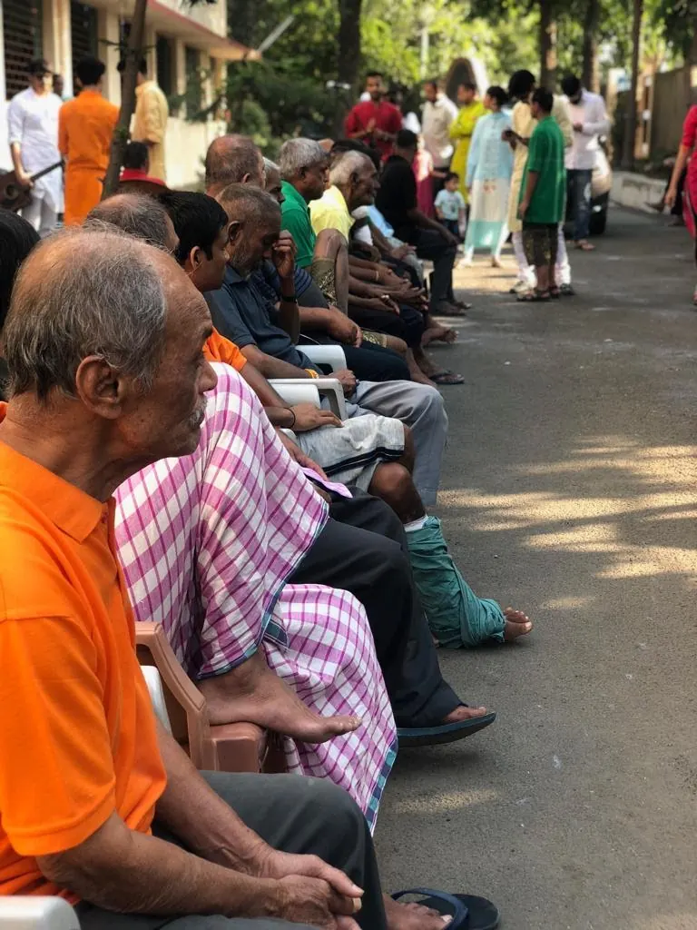 Senior residents seated in a row enjoying the Diwali celebration in 2018