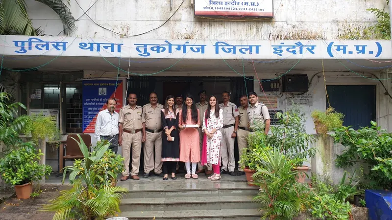 Volunteers with police staff outside Tukoganj police station in Indore